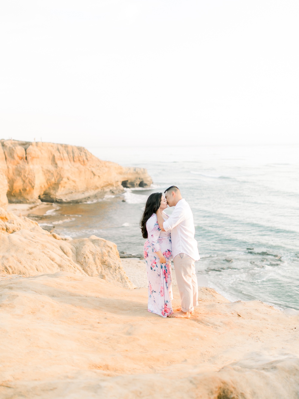 Couple Kissing At Sunset Cliffs Engagement Photos