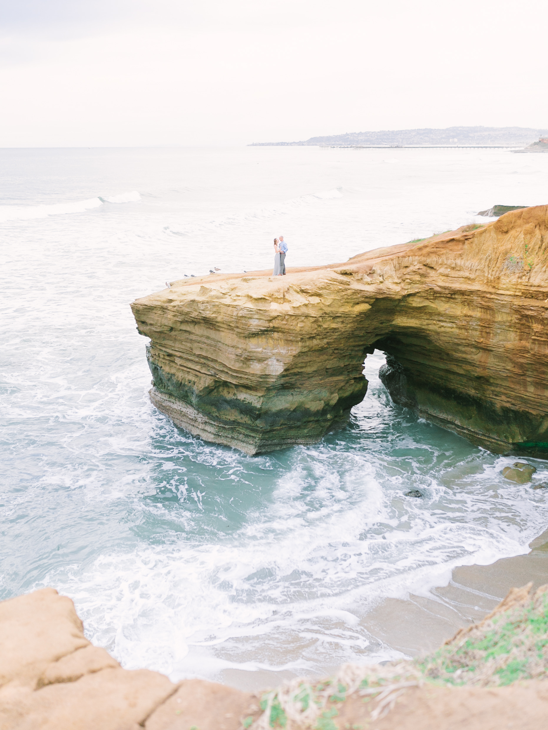 Sunset Cliffs Engagement Photos At The Arch